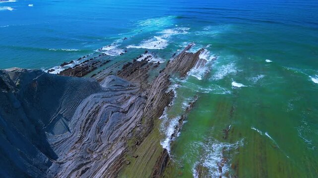Rising tide on the Sakoneta Flysch. Aerial view from a drone on the Cantabrian Coast in Deva. Cantabrian Sea. Gipuzkoa Province. Basque Country. Spain. Europe