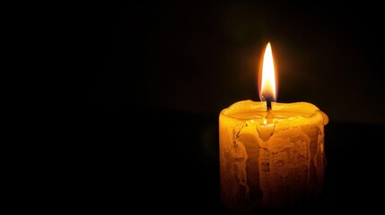 Candle Light. Yellow Flames of Candle Burning in the Dark Background