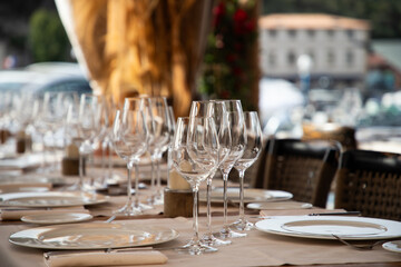 wine glasses on table in fancy restaurant by the sea