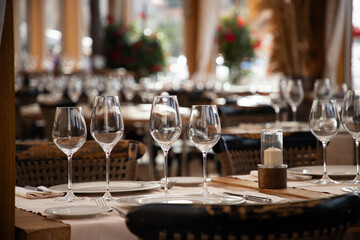 wine glasses on table in fancy restaurant by the sea
