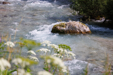 Detailes of water flowing in the Avisio stream - Val di Fassa - Italy
