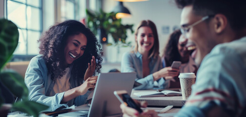 Obraz premium A group of young professionals in an office setting were gathered around one person who was presenting on their tablet to another individual sitting down and smiling at them