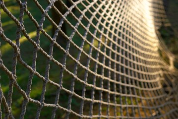 Selective focus on a rope web in an outdoor park playground