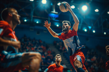 A Handball Player Leaps High For The Shot During A Night Game