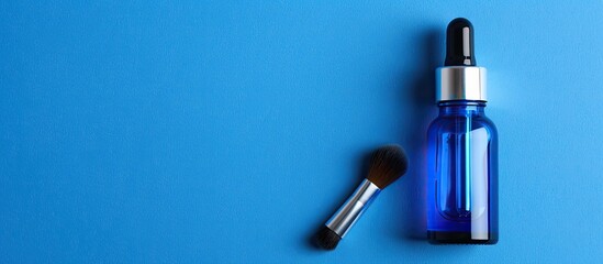 Obraz premium Blank blue eye dropper bottle for cosmetic peels with brush label and room for text copy space image