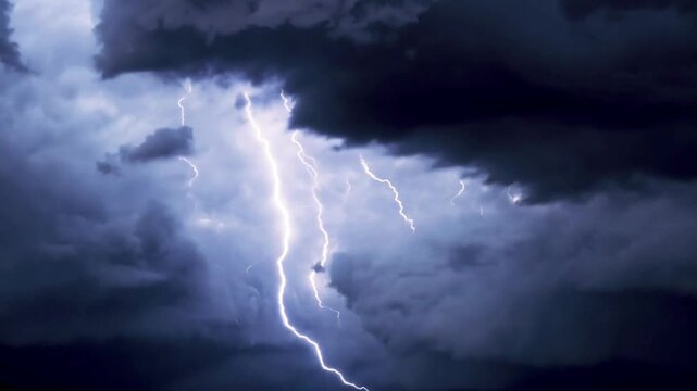 Lightning discharge and light effects in the clouds. Thunderclouds in bright flashes of lightning. Bad weather. Looped . Dark storm 4k