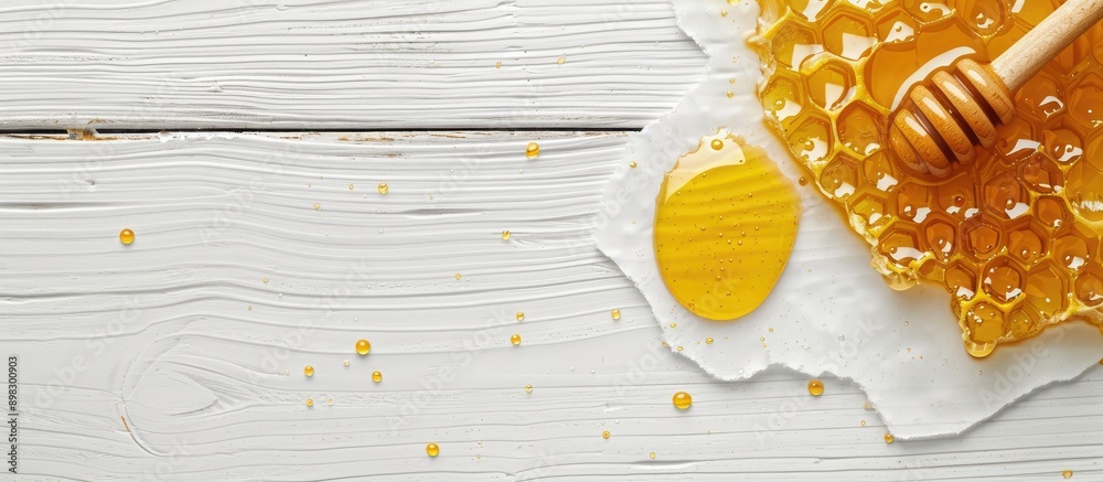 Poster A dollop of honey showcased on a bright white wooden surface with empty space for custom text or image. Creative banner. Copyspace image