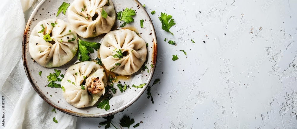 Poster beef and lamb khinkali dumplings presented on a rustic plate with herbs against a white backdrop pro