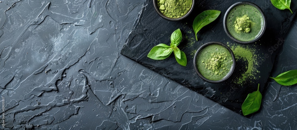 Aufkleber composition featuring green matcha powder and a drink on a black table with room for text in the ima