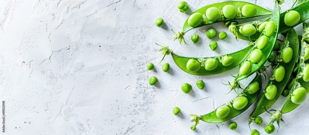 Poster close up of fresh green peas on a white background with copy space image available