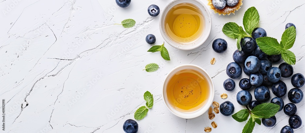 Poster blueberry tarts ingredients arranged on a white background for a minimalistic copy space image