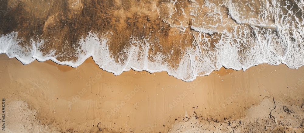 Poster a bird s eye view of a sandy beach with visible sand texture in the background perfect for a copy sp
