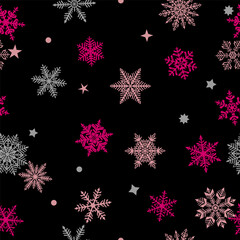 Christmas seamless pattern of beautiful complex red and gray snowflakes on black background. Winter illustration with falling snow.