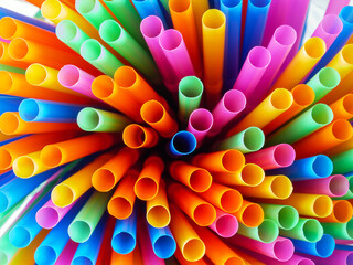 Abstract beautiful multicolored drinking straws, macro rainbow circle of tube background