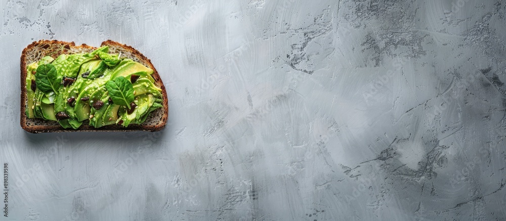 Aufkleber Top view of avocado toast on grey background with copy space image