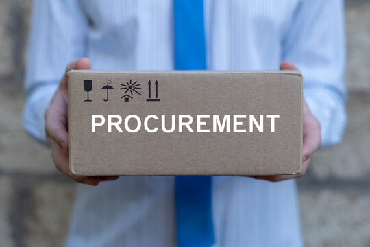 Concept of procurement. Product procurement management. Supply Chain Retail. Businessman holding cardboard box with word: PROCUREMENT.