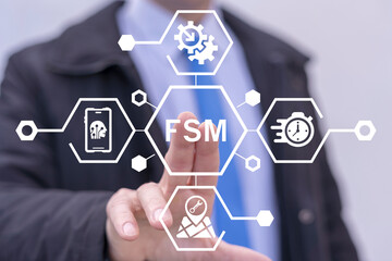 Field Service Management ( FSM ) Business Concept. Business man using virtual touch screen presses abbreviation: FSM.
