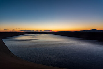 Fototapeta premium Dlouhe Strane dam with Praded hill on the background in Jeseniky mountains in Czech republic during summer sunrise