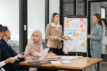 Fototapeta premium Asia business meeting consultations of business people in the company's meeting room. 