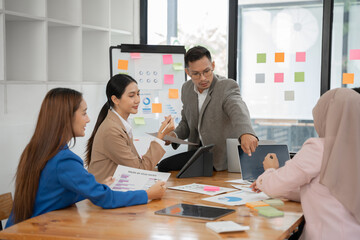 Fototapeta premium Asia business meeting consultations of business people in the company's meeting room. 