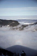 Aerial View Of A Snowy Mountain Range Covered In Fog On A Winter Day. Winter touristic trails in Carpathian mountains, Ukraine