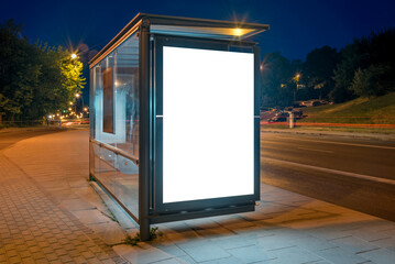 Mockup Of Bus Stop Advertising Billboard On A City Street At Night. Outdoor Poster Lightbox With...
