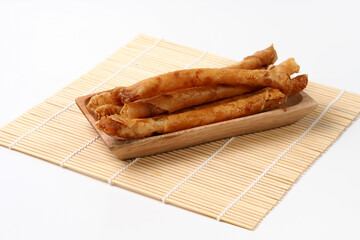 Banana rolls is traditional snacks from Indonesia. made of fried banana wrapped in spring roll skin, cheese roll, street food , good for article