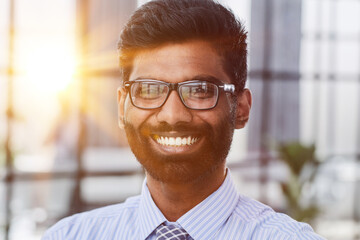 Fototapeta premium Close-up photo portrait of successful and happy businessman, male investor beard looking at camera