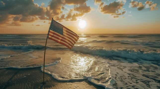 Serene beach at sunrise with the american flag fluttering proudly, casting a golden glow on the waves and shore