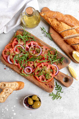 Tomatoes salad  with pesto sauce and arugula summer healthy eating salad