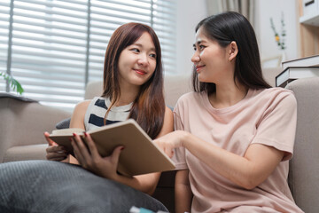 Young Female Friends Studying Together at Home, Helping Each Other Prepare for Exams, Collaborative Learning, Education, and Friendship