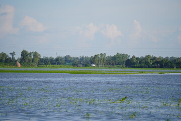 Flood affected rural areas with green agricultural lands.