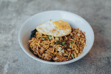 Mie Bangladesh with boiled egg and some vegetables made from instant noodles originate from Medan or Aceh. Typical Southeast Asian food.