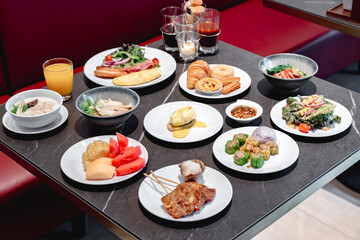 Tropical breakfast buffet at hotel. Fresh food and juices served in luxury outdoor restaurant. Perfect vacation breakfast.