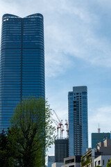 Fototapeta premium Tokyo city skyscrapers against blue sky, Japan
