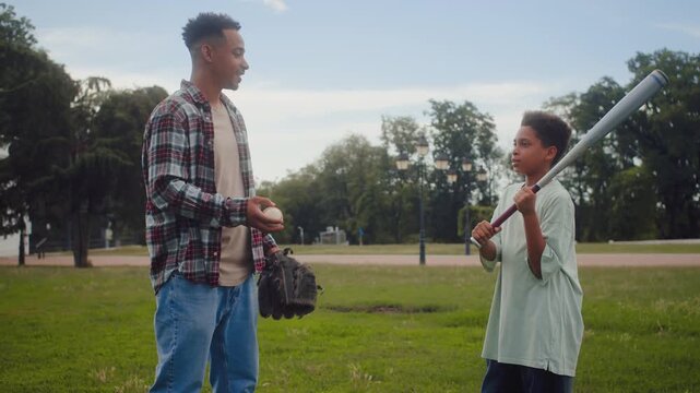 African american father and son talking about new hobby