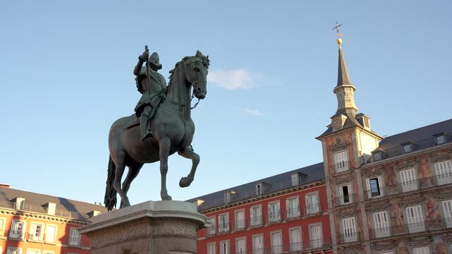 Plaza Mayor Madrid, Spain. Philip III Habsburg Horse Statue Close Up Against Blue Sky. Looking Up Early Morning Light. Felipe III Bronze Sculpture.