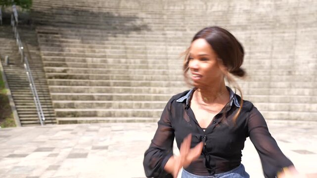 Latin beauty woman gesturing gentile dancing salsa in a park