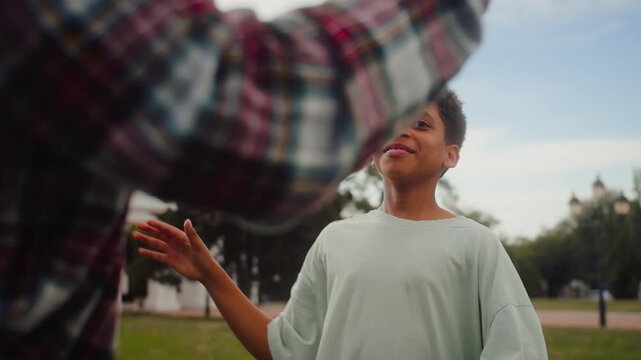 African american kid giving high five to unrecognisable male