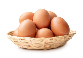 Front view of brown chicken eggs in stack in wicker basket isolated on white background with clipping path
