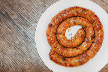 baked sausage. Homemade Pork sausage. Homemade sausage on the plate