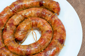 baked sausage. Homemade Pork sausage. Homemade sausage on the plate