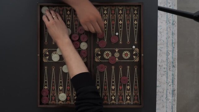 male hands starting position to play backgammon, 4k and 30 fps, top shot.