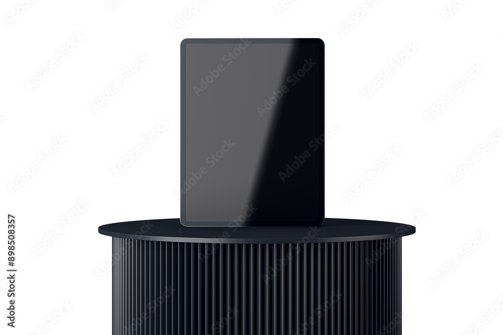Leinwandbilder a digital tablet displayed on a dark, ribbed pedestal in front view. isolated on a white background.