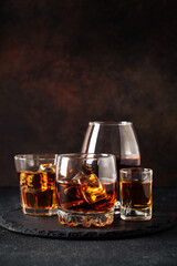 Strong alcohol drink. Whisky, rum, tequila, cognac at dark bar.