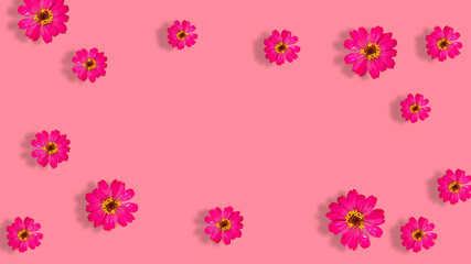 red flower frame on pink background, Creative lifestyle, summer or spring concept. Copy space, flat lay, top view.