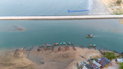 Aerial view of Coast with fishing villages and breakwaters.