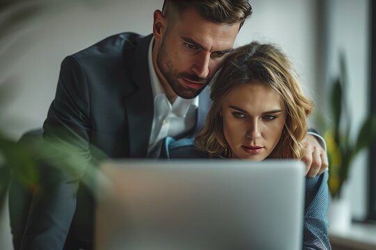 A scene of a man trying to commit sexual harassment to a woman in office.