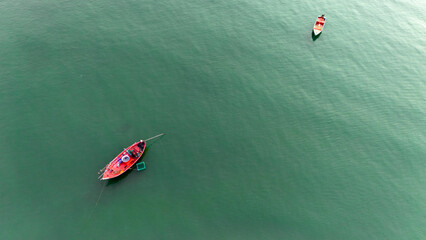Top view of fishing boat in the sea.