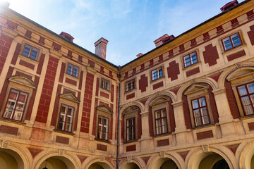 A grand structure with many windows and arches, creating a beautiful facade